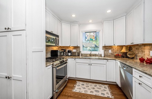 West Beach Cottage | Unique upscale 3 bdrm, 3 bath Oceanwoods cottage on lagoon; 150 yds from beach.