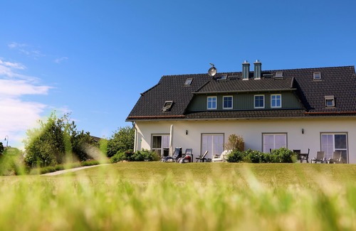 Middelhagen House | Vacation home with water view, large garden, 4 bedrooms, 2 bathrooms, sauna, fireplace