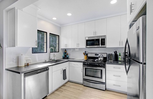 Panorama City House | Velvet and Brass Cozy Four BedroomnPoolside & Hot Tub Retreat