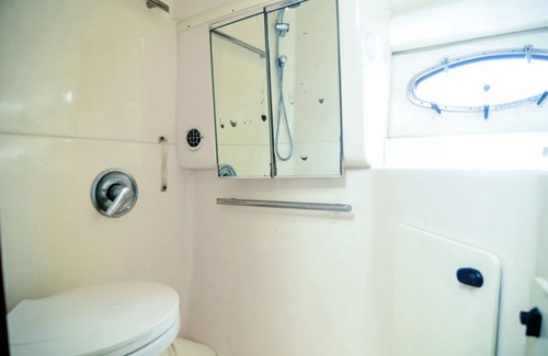 La Romana Boat Rental | Very luxurious accommodation on a boat, room, bathroom and fine wood finishes.