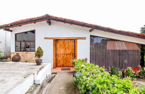 Roble House | View paradise with an expansive yard, wood-burning fireplace, and W/D