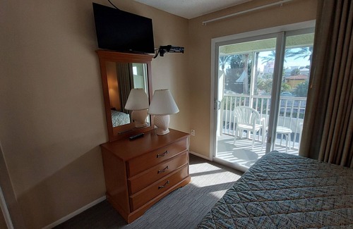 Belle Vista Resort | Walk out to the Beach from your 2 Bedroom Condo or swim in the pool. Sleeps 6
