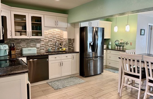 Sunny Shores House | Walk to the beach! Spacious home with comfy beds, game room, & fenced yard.