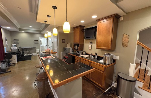 Raleigh Apartment | Walkout Basement apartment with a private entrance facing a wooded backyard.