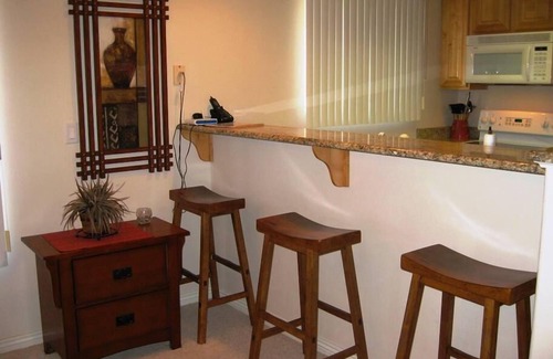 Mesquite Condo | Wandering Wolf Hideaway by Mesquite Vacation Rentals at Wolf Creek Golf Course! Parking Level and $510 in free daily activities