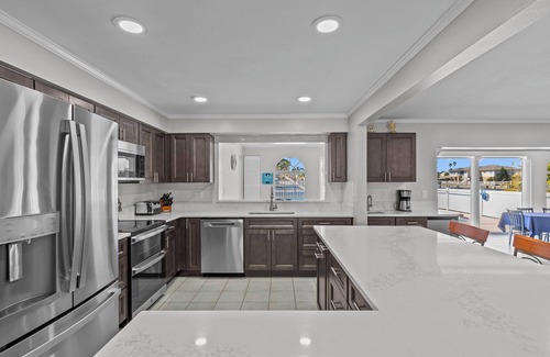 Gulf Harbors House | Water Front Home with Heated Pool & Hot Tub, 2 Master Suites & a Floating Dock