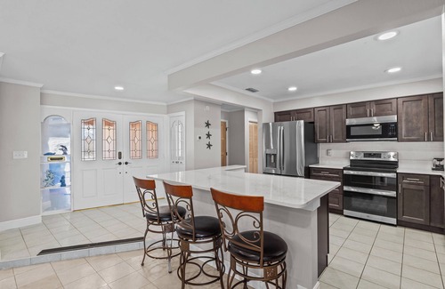 Gulf Harbors House | Water Front Home with Heated Pool & Hot Tub, 2 Master Suites & a Floating Dock