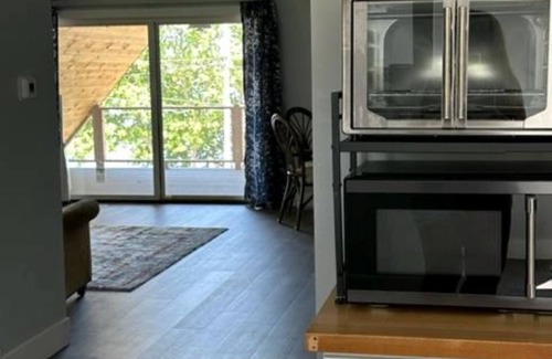 Sturgeon Bay Apartment | Water views from every window, covered porch & private deck, 7 min walk to beach