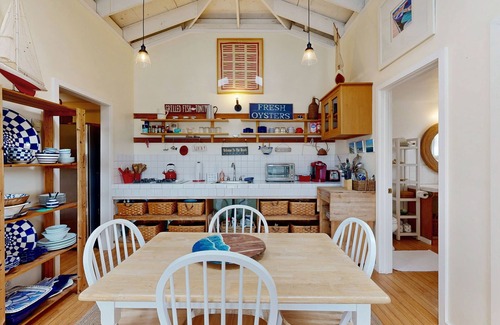 Salmon Creek Cottage | Waterfront home with views of the mountains and Salmon Creek - dogs welcome