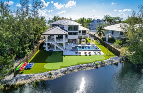 Rock Harbor Villa | Waterfront Luxe Pool, Hot Tub, Theater, Games and More!