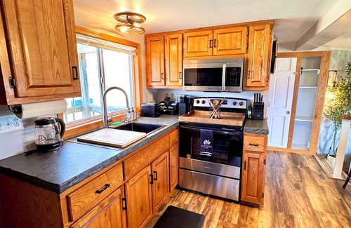 Oconto Cabin | Waterfront Oconto Cabin – 2BR Retreat w/Pier & Free Kayaks, Dogs OK