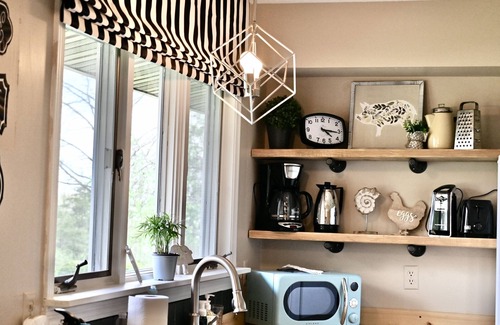 Ava House | We are a quiet ranch home that sits on 8 acres with firepit, pond and bar.