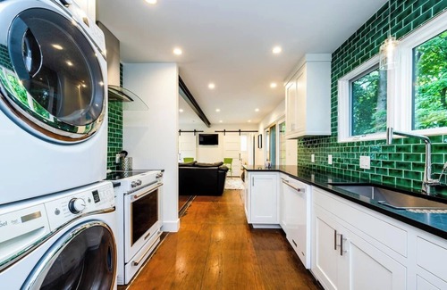 Benton Harbor Apartment | Welcome to a one-of-a-kind getaway in this modern and thoughtfully designed container home. Nestled in a quiet, wooded lot within Benton Harbor, the home offers a peaceful retreat just minutes from the beaches of Lake Michigan and charming shops