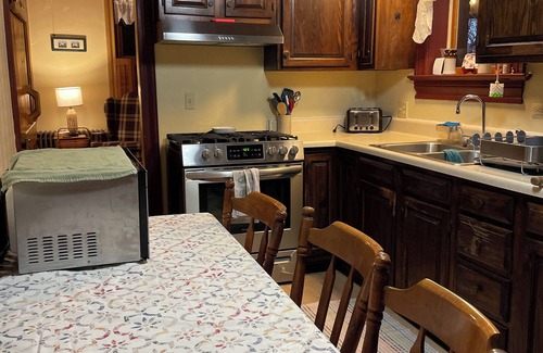 McClellandtown House | Welcome to Watson's Woodland Manor-a charming 1825 historic home nestled in the heart of Deer Creek Winery. This spacious retreat sleeps up to 12 guests, making it perfect for families, friend groups, wedding parties, or reunions. 3 bedroo