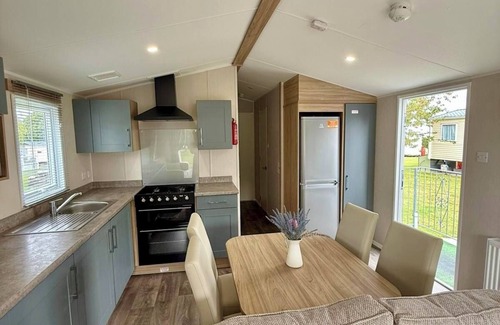 Cross Inn House | Welcoming family caravan on large pitch near beautiful New Quay in West Wales