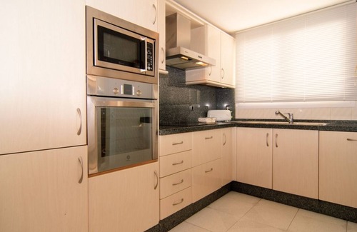 Nikki Beach Apartment | White Pearl Beach apartment with shared heated pool, BBQ