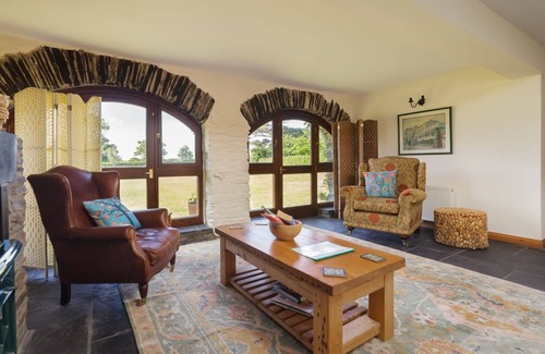 Jurby Cottage | Wisteria Cottage is set in the north of the Isle of Man in an expanse of farmland providing the perf