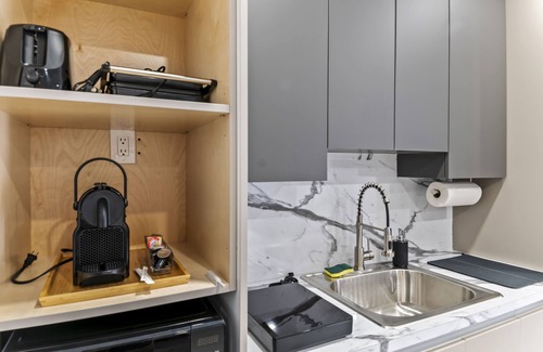 Richmond West Apartment | XL Luxury Room. Luxurious studio retreat with sleek designs.