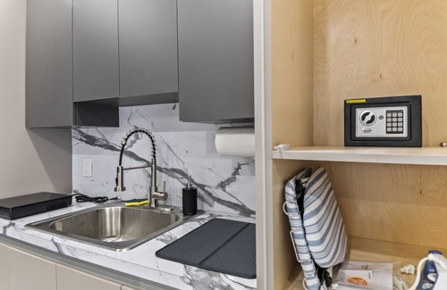 Richmond West Apartment | XL Luxury Room. Luxurious studio retreat with sleek designs.