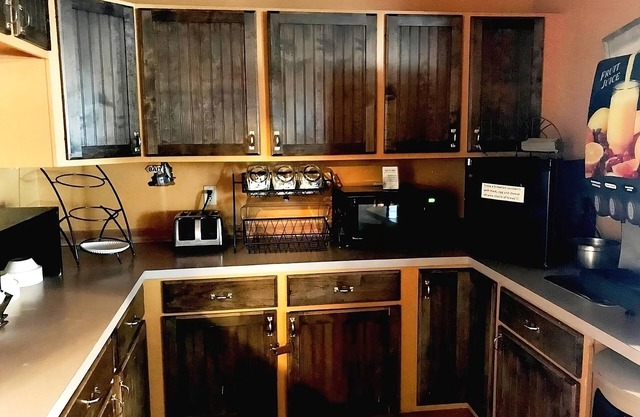 1 King Bed with Recliner at FairBridge Inn & Suites Kellogg