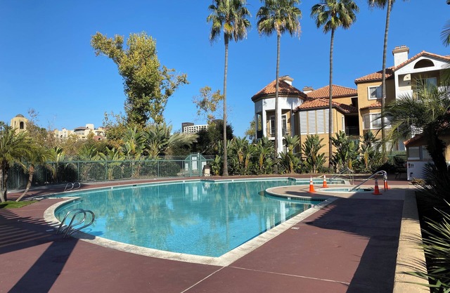 2 BR 2BA condo with AC, 2 parking spots, pool, walk to eat and shop