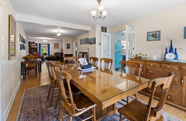 2 units with 6 bedrooms, 6 bathrooms, a kitchen and large dining area.