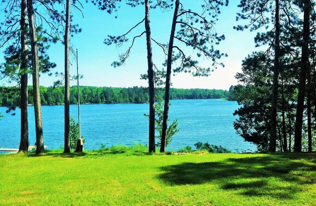 2015 Built Lakeshore Cabin with 220 of shoreline, sandy beach on 8 private acres