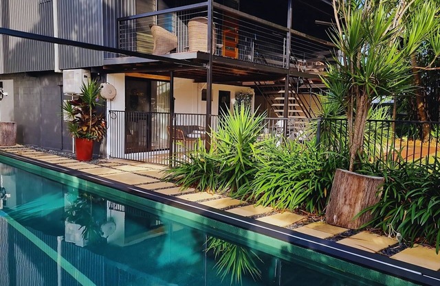4 BEDROOM TROPICAL HOME + LAP POOL + PARKING FOR CARAVANS, BOATS OR TRAILERS.