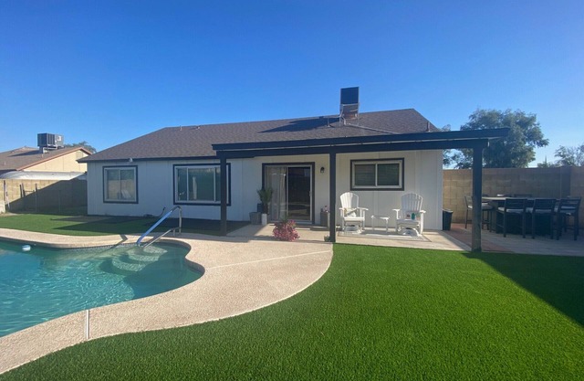 4 BR, 2 BA home with heated pool located near shopping, dining & entertainment