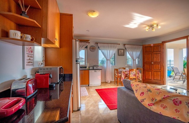 4' from the sea family house in a garden with lawn and trees