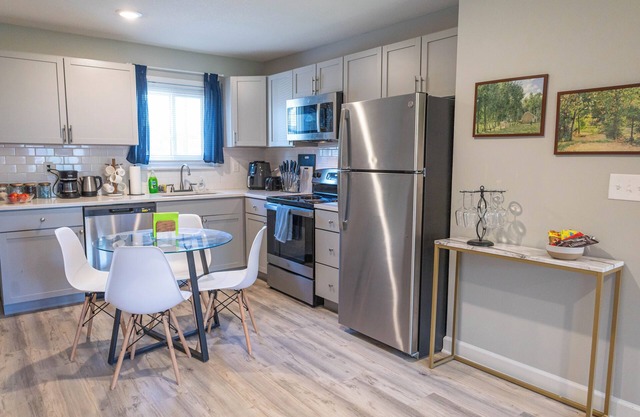 A charming bedroom with a king bed in quiet Shawnee neighborhood near highways.