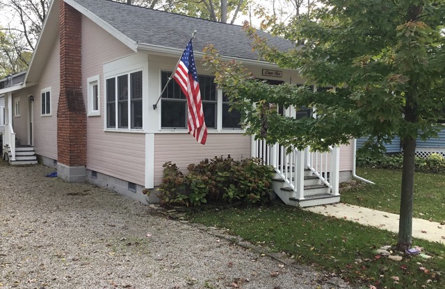 A picture perfect restored original cottage located inside the gates of Lakeside