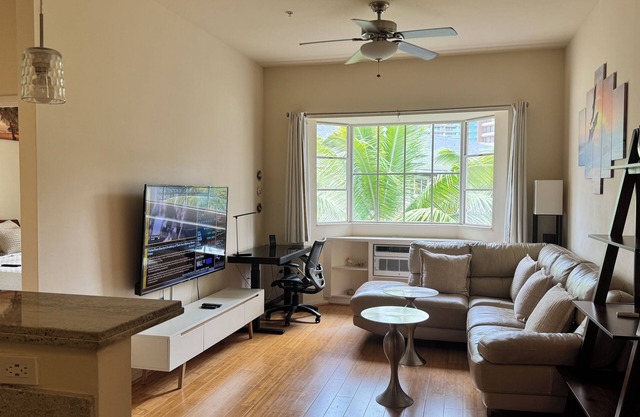 A prime location in Waikiki with an EV parking