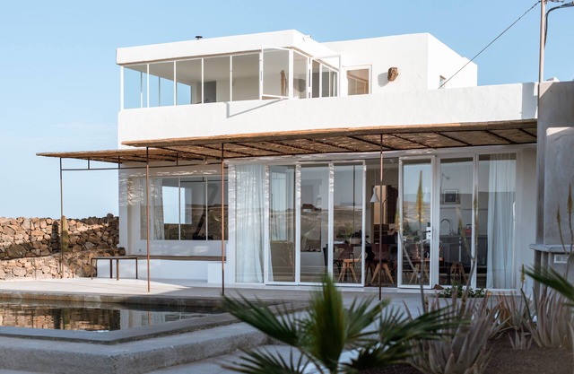 An architectural oasis with large swimming pool, along a breath-taking scenery.