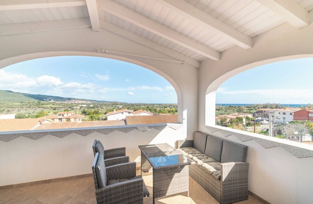 Apartment 'Attico Con Vista Mare A Budoni' with Sea View, Terrace and Air Conditioning