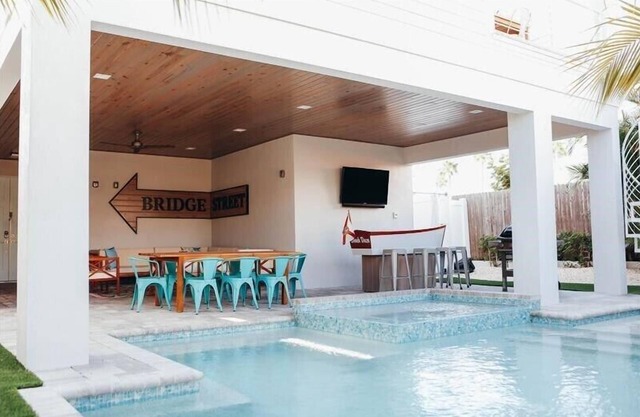 Beach Daze - 7 bedrooms short walk to beach with private heated pool & spa