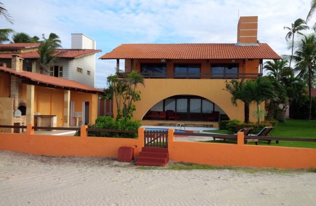 Beach house with swimming pool, terrace and walk in the sand.