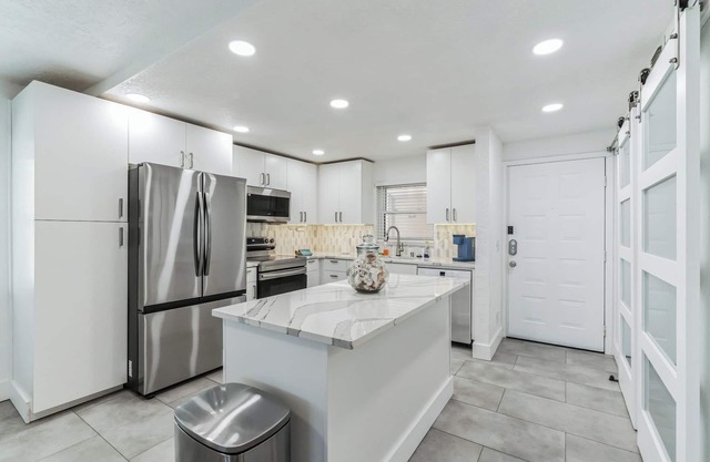 Beachfront 2 bedroom, 2 bathroom renovated condo, pool, hot tub, private beach!