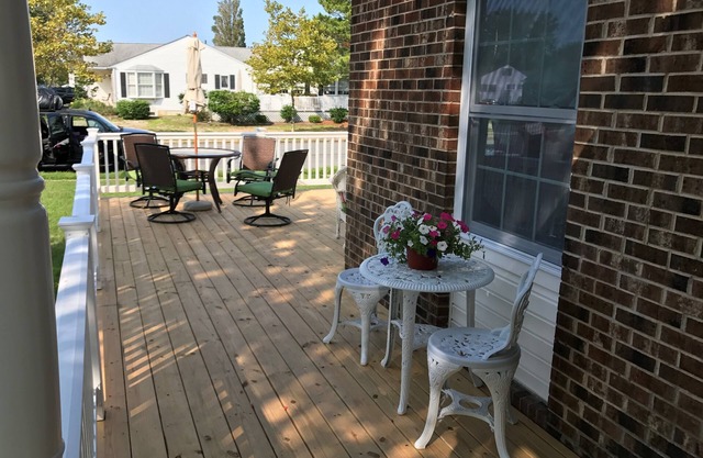 Beautiful corner property with cozy beach vibe.