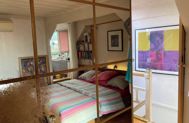 Bedroom, bathroom and terrace in artist's loft-atelier.