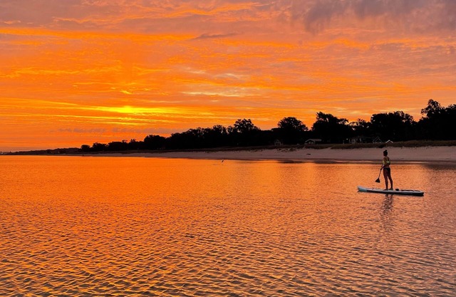 Blocks from the beach with giant covered deck, firepit, and grill!