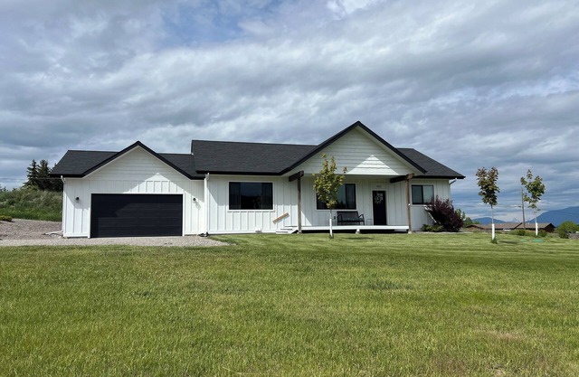 Brand new house with deck and amazing views on large country lot close to town.