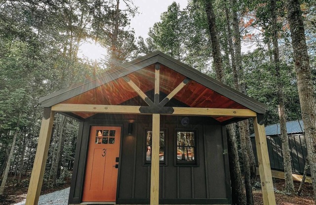 Cabin #3: One king-size bed, a full kitchen, and a large gravel parking pad beside the cabin for easy boat or trailer storage.