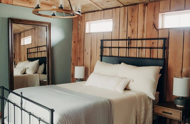 Cabin Just Built! features two covered decks, living room, fireplace, kitchen