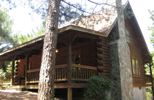 Cabin with a fire place in the woods