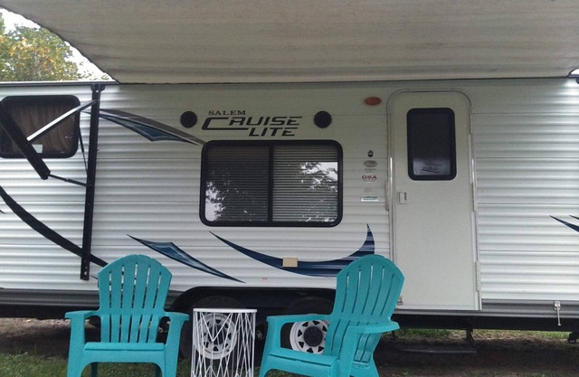 Camper near pool at Pebble Hill RV Resort