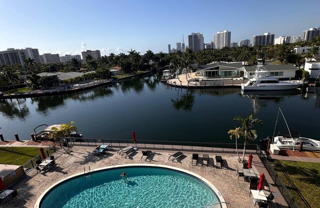 Canal & Pool View Chic 1BR with Balcony – Short Stroll to Hallandale Beach