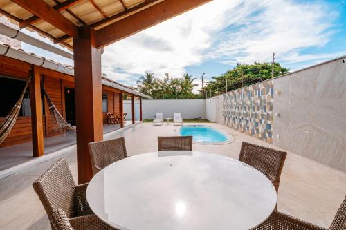 casadecastelhanos, Quadra do MAR de CASTELHANOS, 4 suítes com AR, Churrasqueira, Piscina, Hidromassagem, Cozinha INTEGRADA GOURMET Ideal para FAMÍLIA E AMIGOS