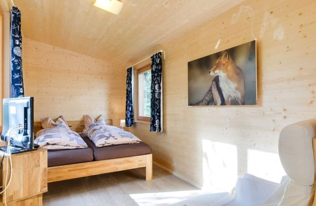 Chalet on the edge of the forest with a large glass front