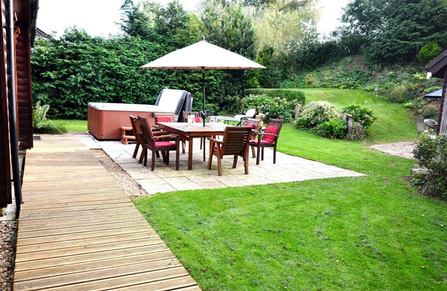 Character 4 bedroom lodge with hot tub in a beautiful 1/4 acre setting.